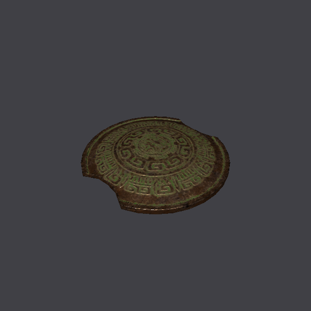 Dark round shield with an aged green tint and a carved pattern, lying flat