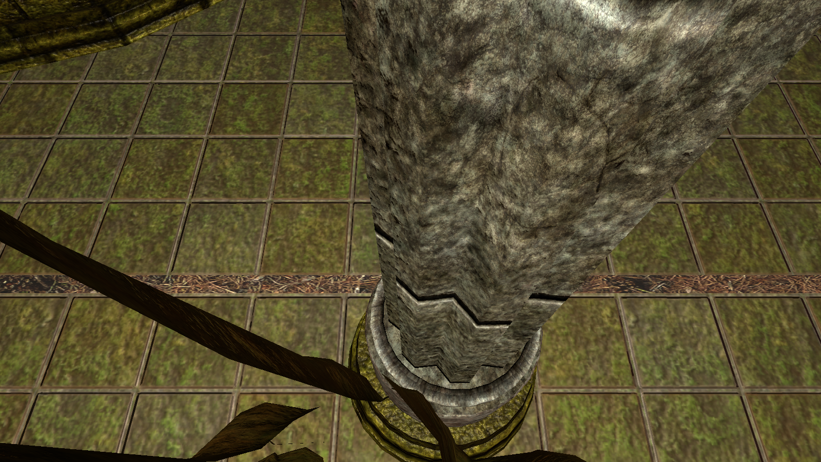 Stone dungeon floor with a strip of outdoor ground showing through it