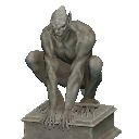 A crouching gargoyle statue on a plinth