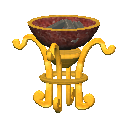 A brass brazier stand with an empty bowl