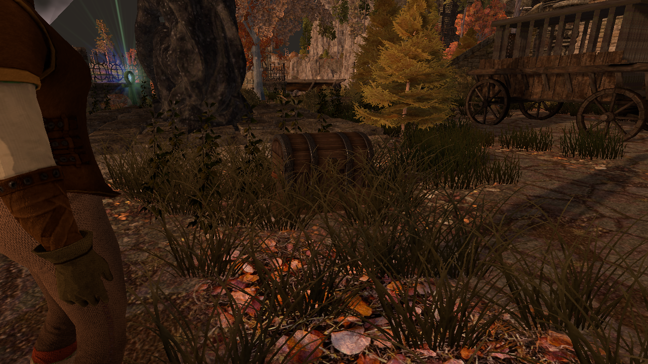 The treasure chest sitting in the grass at the Libris Ruins dig site, spawned by the new timeout fallback during verification, with the ruined library and an old cart behind it
